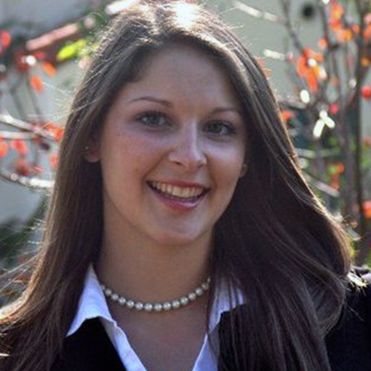 smiling-woman-at-event-with-string-lights-background